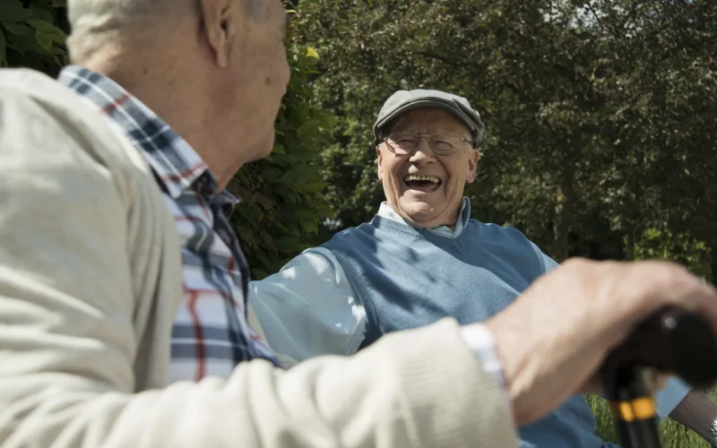 Two old friends having fun in the park